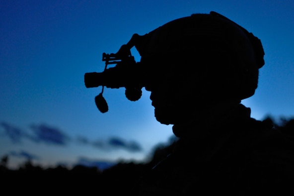 Senior Airman Brandon W. Motley watches for air support with night vision during evening operations Aug. 13, 2014, on the Grayling Air Gunnery Range during Operation Northern Strike in Grayling, Mich. Northern Strike was a three-week exercise led by the National Guard that demonstrated the combined power of joint and multinational air and ground forces. Motley is a tactical air control party specialist with the 169th Air Support Operations Squadron. TACPs were with the Air National Guard’s 169th ASOS from Peoria, Ill., and more than 5,000 other armed forces members from 12 states and two coalition nations participated in the combat training. (U.S. Air National Guard photo/Staff Sgt. Lealan Buehrer)

