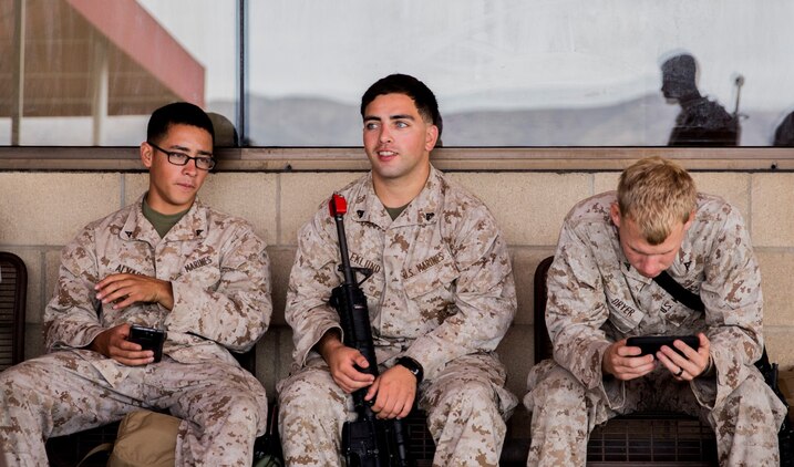 Lance Cpl. Alfredo Alvarez, left, Cpl. Sean Eklund, and Lance Cpl. Tyler Dryer wait for their flight to Marine Corps Mountain Warfare Training Center from Marine Corps Air Station Camp Pendleton, Calif., on Aug. 19, 2014. These Marines will participate in Mountain Exercise at MCMWTC aboard Bridgeport, Calif. Alvarez, water supply technician, 21, is from San Juan, Texas, Eklund, field radio operator, 22, is from Omaha, Nebraska, Dryer, engineer equipment mechanic, 22 is from Centerville, Texas. All three are assigned to Combat Logistics Battalion 15. (U.S. Marine Corps photo by Sgt. Emmanuel Ramos/Released) 
