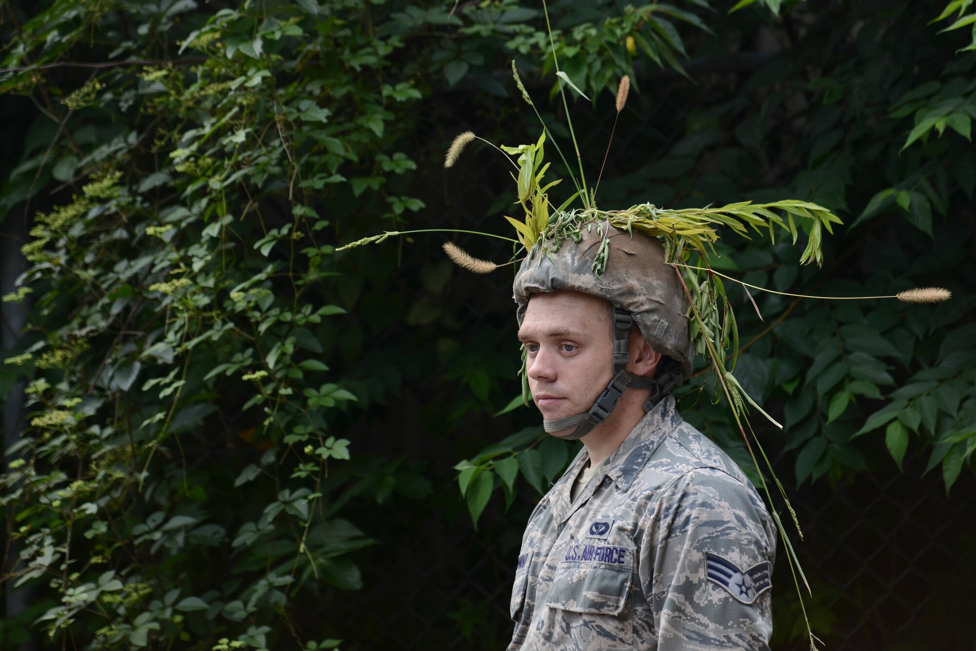 An Airman of the 374th Civil Engineer Squadron takes a break after completing the cover and concealment portion of the 374 CES Prime Beef training day at Yokota Air Base, Japan on Aug. 21, 2014. This month’s training focused on combat tactics. (U.S. Air Force photo by Senior Airman Michael Washburn/released)
