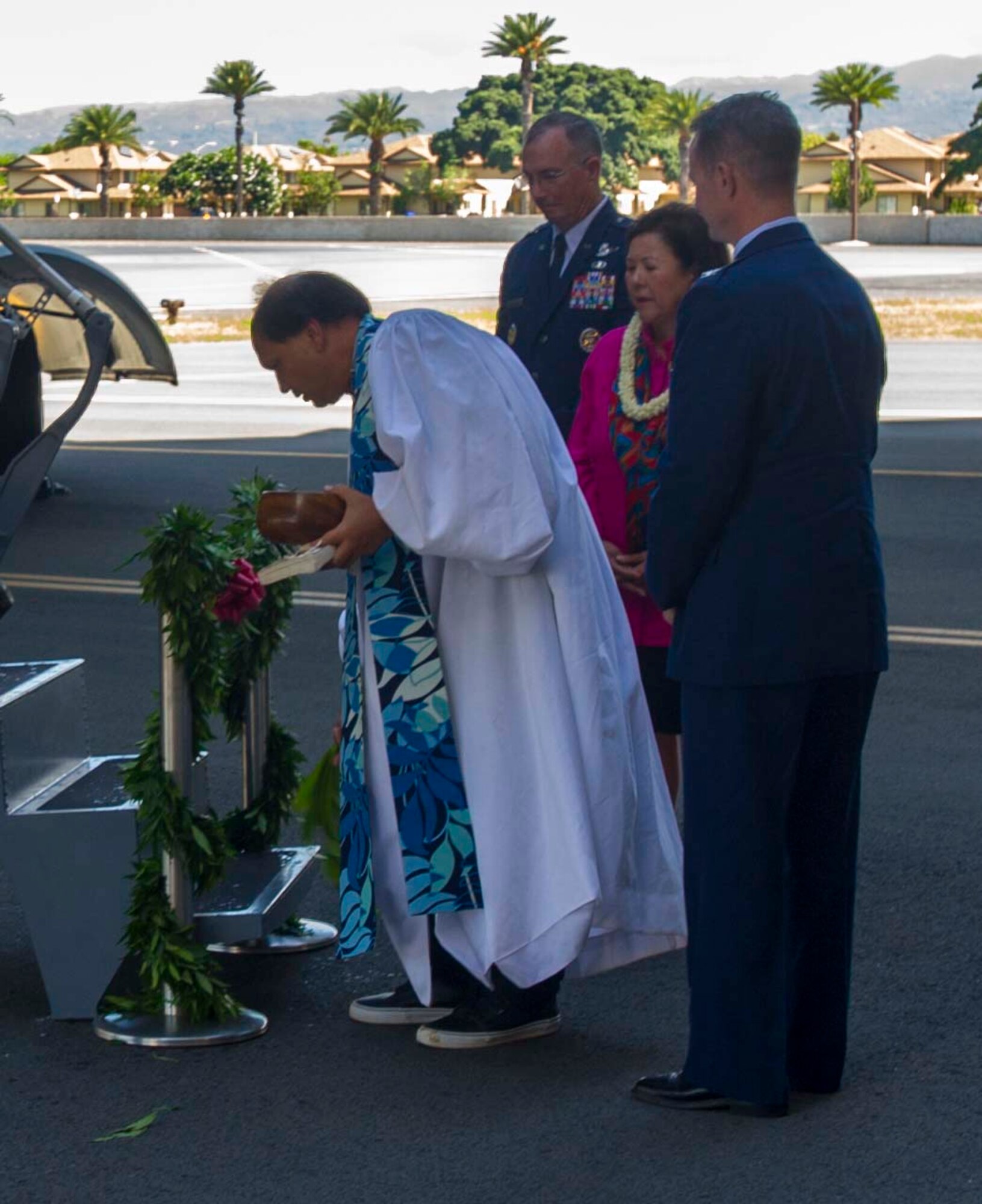 Reverend Kahu Kordell Kekoa  gives a traditional Hawaiian blessing to a 535th Airlift Squadron C-17 Globemaster III on the Joint Base Pearl Harbor-Hickam, Hawaii, flightline Aug. 20, 2014, as Col. Randall Huiss, 15th Wing commander, Irene Hirano Inouye, widow of Sen. Daniel Inouye, and Maj. Gen. Paul McGillicuddy, Pacific Air Forces vice commander, look on. During the ceremony, the C-17 was dedicated to the memory of local and national hero and Medal of Honor recipient Sen. Daniel Inouye. (U.S. Air Force photo by Tech. Sgt. Terri Paden)