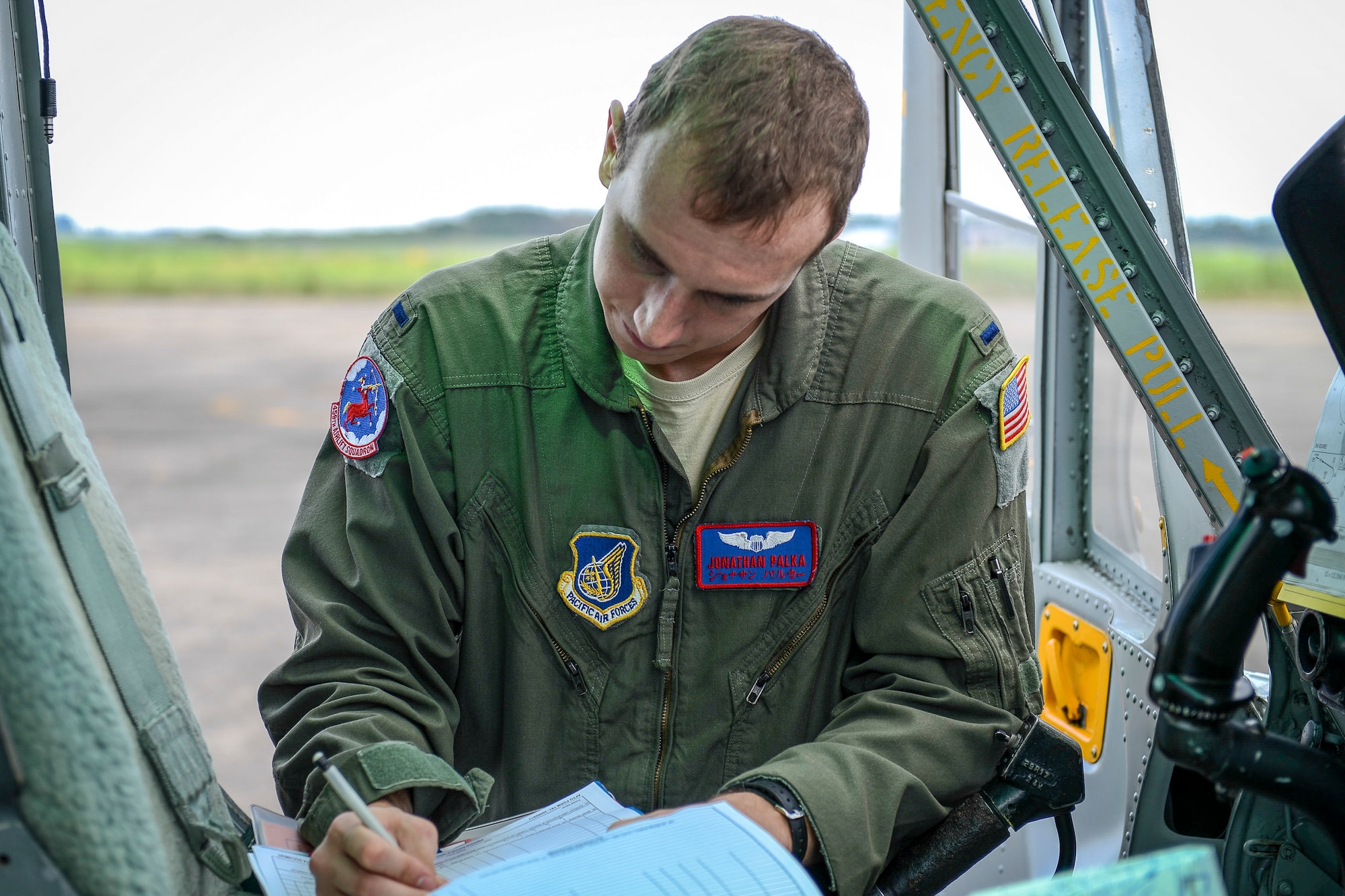 1st Lt. Jonathan Palka, 459th Airlift Squadron UH-1N Huey pilot, logs a flight record after landing at Sendai Airport, Miyagi prefecture, Japan on Aug. 20, 2014. Airmen from the 459 AS regularly practice their airlift capabilities in order to respond to regional contingencies. (U.S. Air Force photo by Airman 1st Class Meagan Schutter/Released)