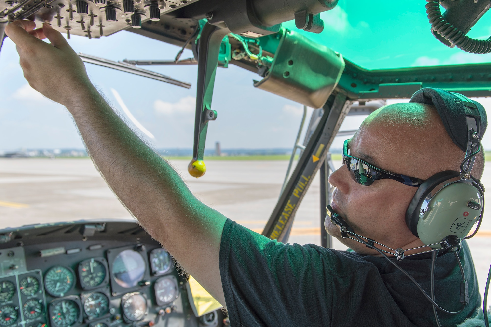 Todd Hanson, 374th Maintenance Group contractor, inspects a UH-1N Iroquois instrument panel at Yokota Air Base, Japan on Aug. 20, 2014. The UH-1N maintainers from the 374th MXG ensure the helicopters are prepared to respond to any type of mission—day or night. (U.S. Air Force photo by Osakabe Yasuo/Released)