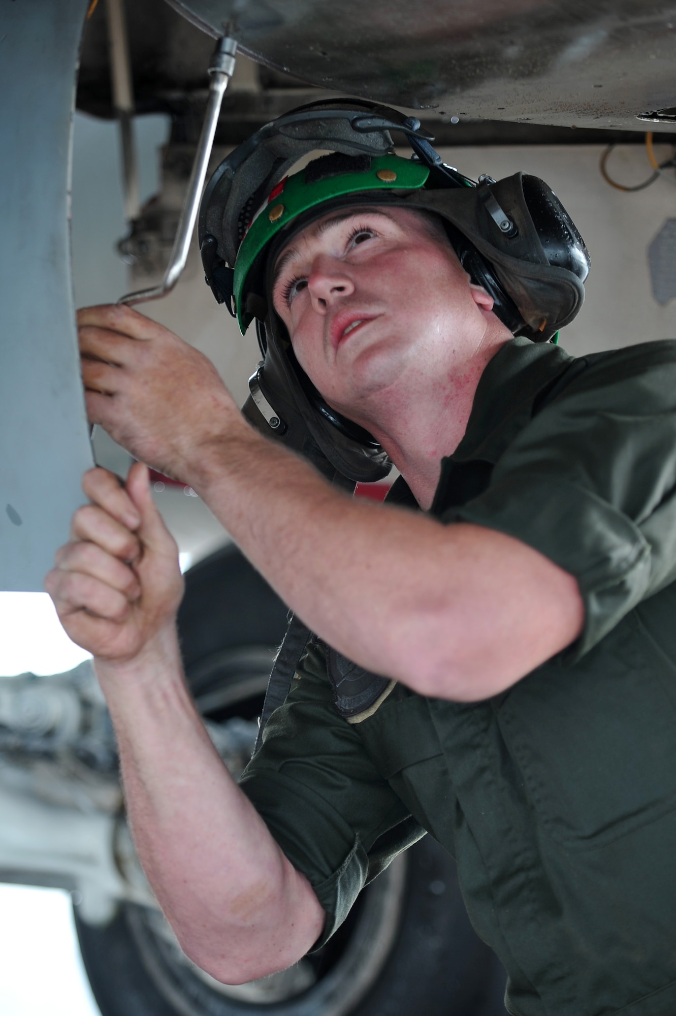 U.S. Marine Corps Lance Cpl. Dylan Hashman, air framer assigned to Marine Fighter Attack Squadron 323, Marine Corps Air Station Miramar, Calif.,  performs pre-flight inspections on a F/A-18C Hornet during RED FLAG-Alaska 14-3 Aug. 18, 2014, Eielson Air Force Base, Alaska. The Hornet is designed for strike applications such as interdiction and close air support without compromising fighter capabilities. (U.S. Air Force photo by Staff Sgt. Jim Araos/Released)