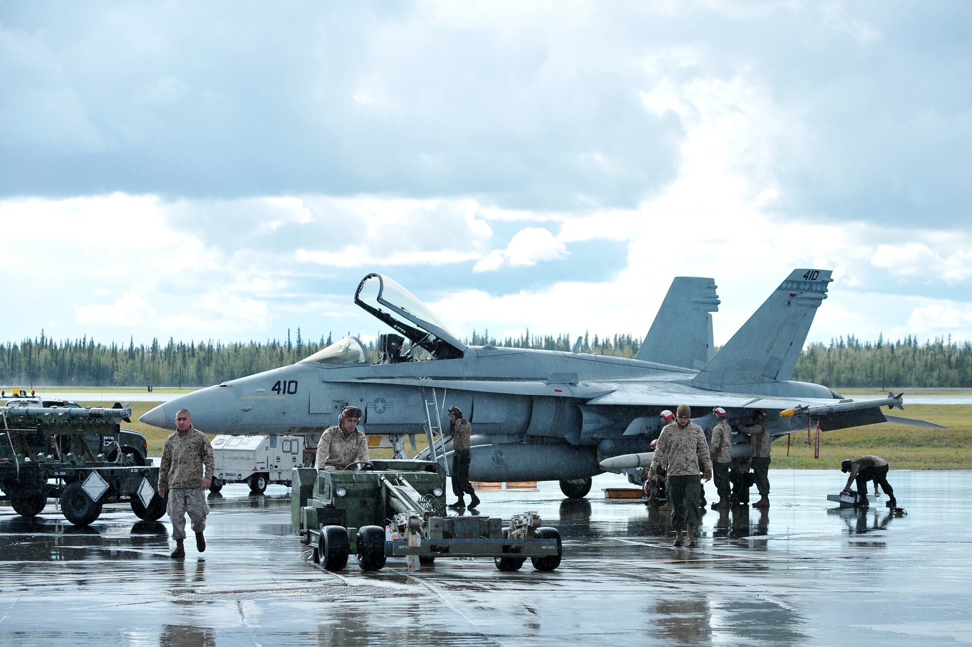 U.S. Marine Corps F/A-18C Hornets assigned to the Marine Fighter Attack Squadron 323, Marine Corps Air Station Miramar, Calif., take off during RED FLAG-Alaska 14-3 Aug. 18, 2014, Eielson Air Force Base, Alaska. In its attack mode, the jet is used for force projection, interdiction and close air support. (U.S. Air Force photo by Staff Sgt. Jim Araos/Released)