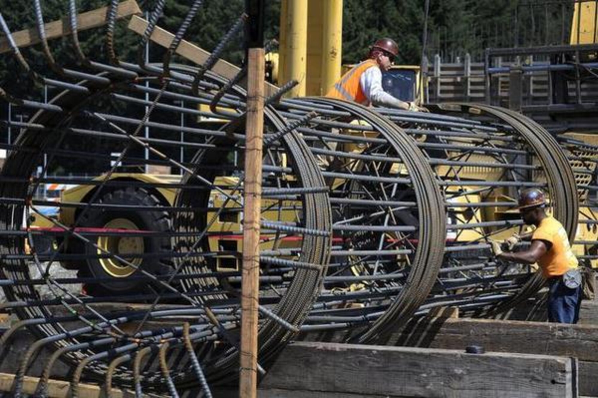 A construction crew prepares a bridge support column girder Aug. 18 for the $7.5 million JBLM Connector road project between JBLM Lewis Main and JBLM McChord Field. Local elected officials got a firsthand look at construction during a tour of the Joint Base Lewis-McChord connector road site. (Curtesy photo/ Northwest Guardian) 