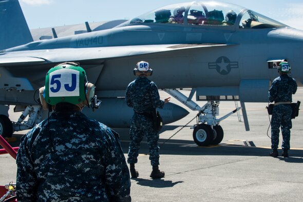 Navy maintenance personnel completes checks before take-off Aug. 6, 2014, at Naval Air Station Whidbey Island, Wash. Each branch of service has its own specialties that fit together like puzzle pieces, but it also has more meaning for some. (U.S. Air Force photo by Airman 1st Class Malissa Lott)
