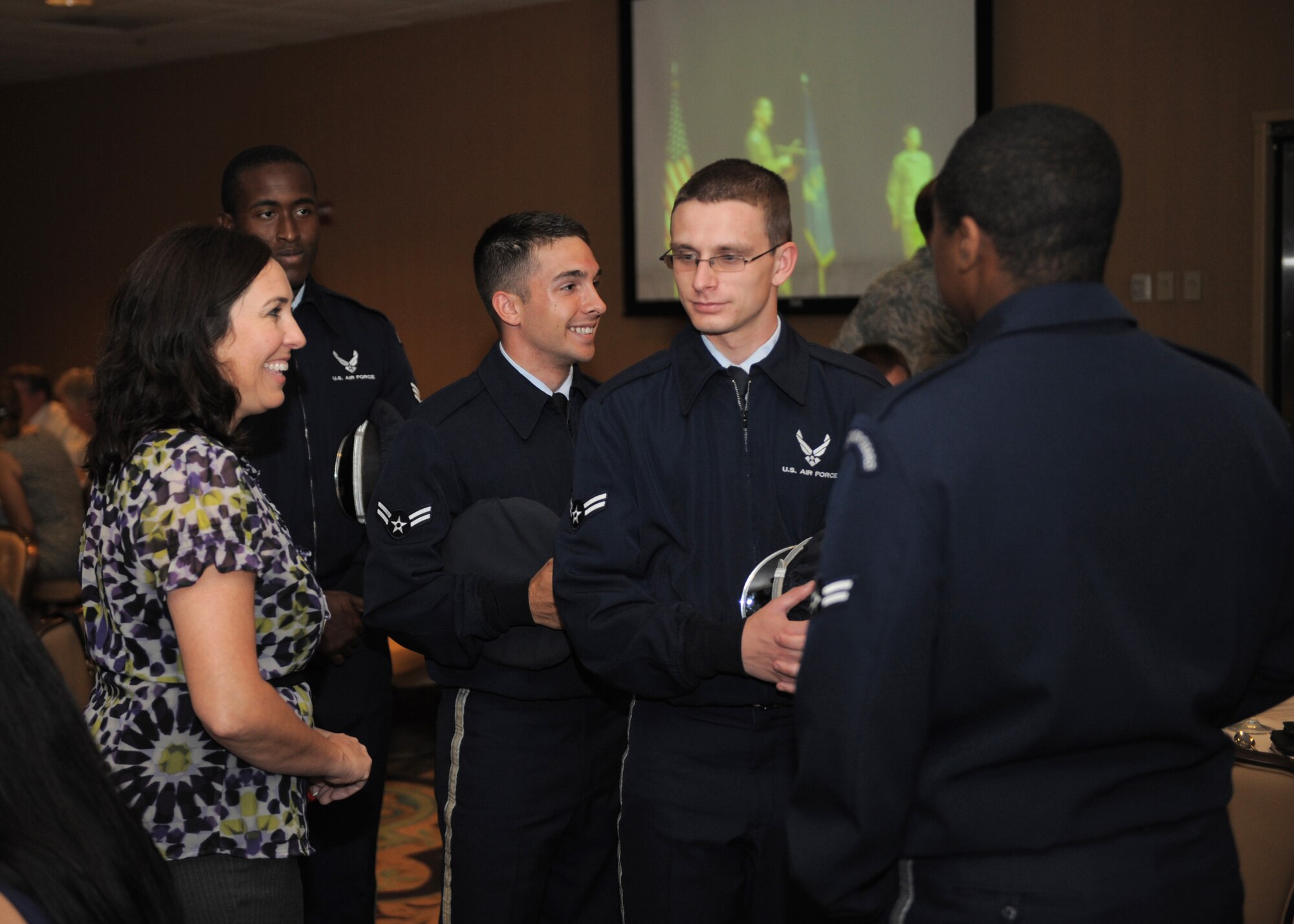 Ellen Jimenez, Tucson Metro Chamber Military Affairs Committee chairperson, converses with members of Davis-Monthan’s Base Honor Guard at Davis-Monthan Air Force Base, Ariz., Aug. 7, 2014. The MAC has been an advocate for community relations, education, recognition programs and support of service members since 1929. (U.S. Air Force photo by Airman 1st Class Chris Drzazgowski/Released)