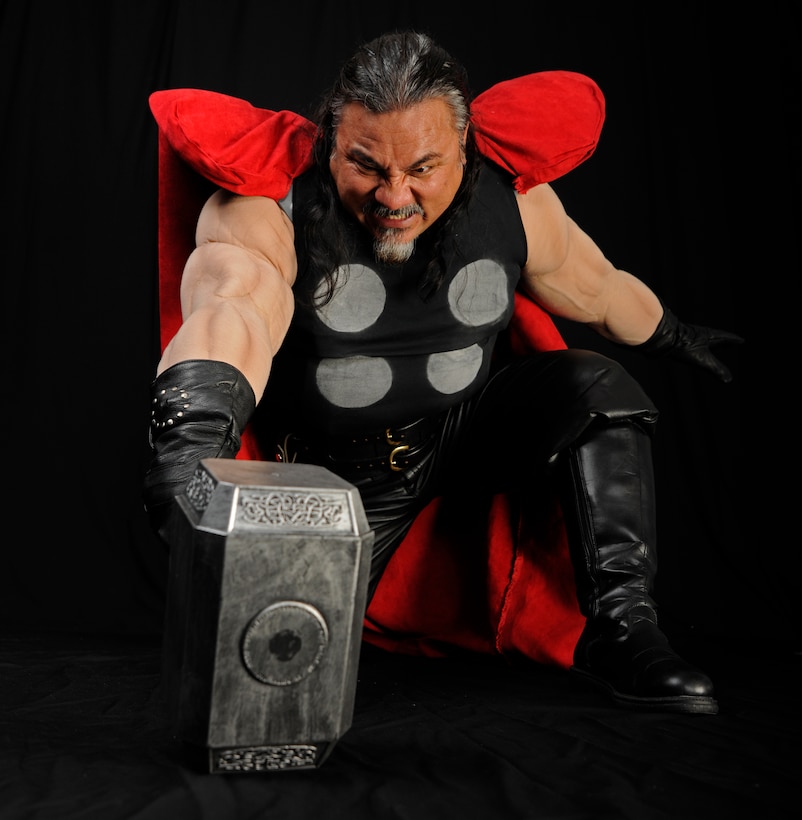 Randy Sena,11th Wing/Joint Base Andrews chief of exercises, strikes a blow for justice in a Thor costume he made himself.  And avid cosplayer, Sena has won several awards for his designs. (U.S. Air Force photo/Staff Sgt. Torey Griffith)