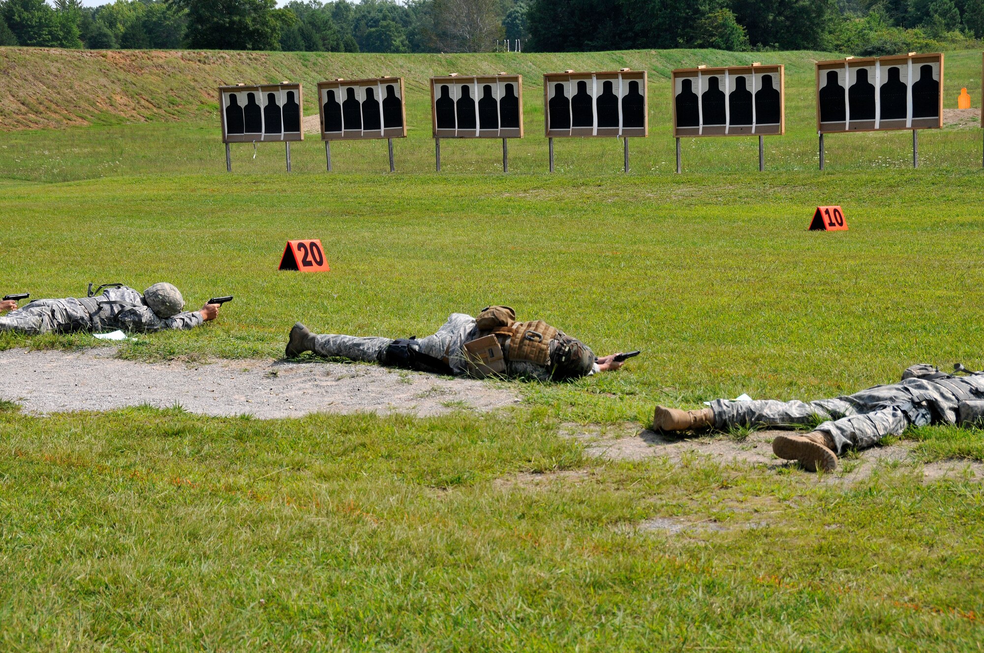 Members of the Tennessee Army and Air National Guard hone their shooting skills in the prone position with a Beretta M9 service pistol during a training session at the 2014 Tennessee Adjutant General Marksmanship Pistol Match in Tullahoma, TN on Aug 15. The Tennesee TAG Match is held anually to promote marksmanship skills in the Army and Air National Guard.  (U.S. Air National Guard photo by Master Sgt. Kendra M. Owenby, 134 ARW Public Affairs)