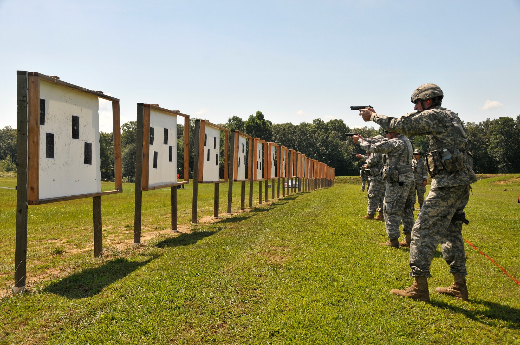 Members of the Tennessee Army and Air National Guard practice thier target acquisition skills with a Beretta M9 service pistol during a training session at the 2014 Tennessee Adjutant General Marksmanship Pistol Match in Tullahoma, TN on Aug 15. The Tennesee TAG Match is held anually to promote marksmanship skills in the Army and Air National Guard.  (U.S. Air National Guard photo by Master Sgt. Kendra M. Owenby, 134 ARW Public Affairs)