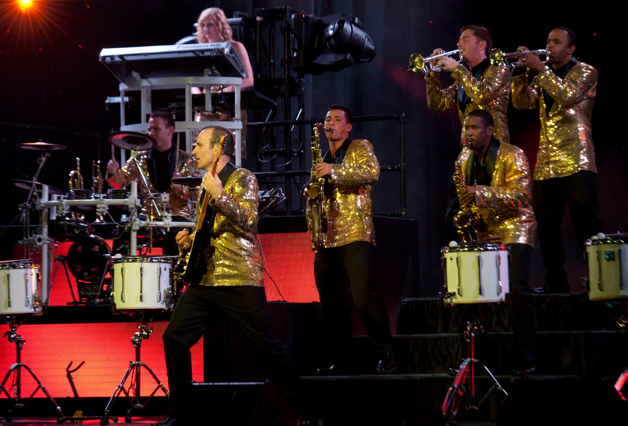 U.S. Air Force Tops in Blue members showcase their opening song during a performance Aug. 19, 2014, at the Wings Over the Rockies Air and Space Museum in Denver. Tops in Blue is the Air Force’s premier entertainment showcase that tours around the world, performing in 20 countries and more than 70 locations in the United States each year. (U.S. Air Force photo by Airman 1st Class Samantha Saulsbury/Released) 