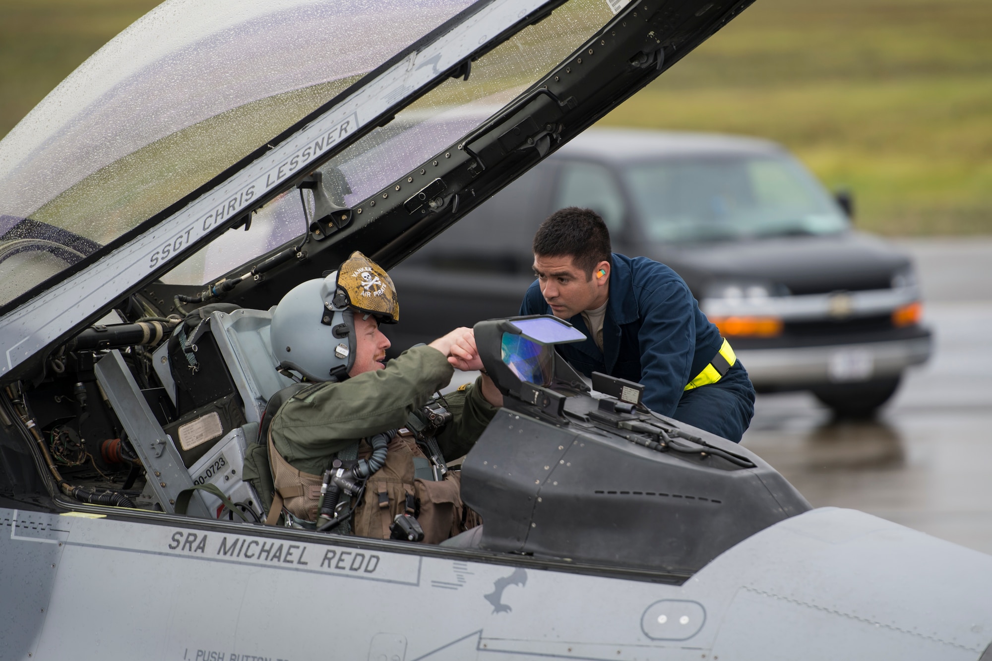 U.S. Air Force Capt. Sean Foote, 80th Fighter Squadron F-16 Fighting Falcon pilot and Staff Sgt. Jason Chavez, 8th Aircraft Maintenance Squadron crew chief, both assigned to Kunsan Air Base, South Korea, talk just prior to Foote's  departure for a sortie during RED FLAG-Alaska 14-3 Aug. 19, 2014, Eielson Air Force Base, Alaska. Foote participated in full-scale combat simulations involving team work from the U.S. Navy, U.S. Marine Corps and Air National Guard. (U.S. Air Force photo by Senior Airman Peter Reft/Released)