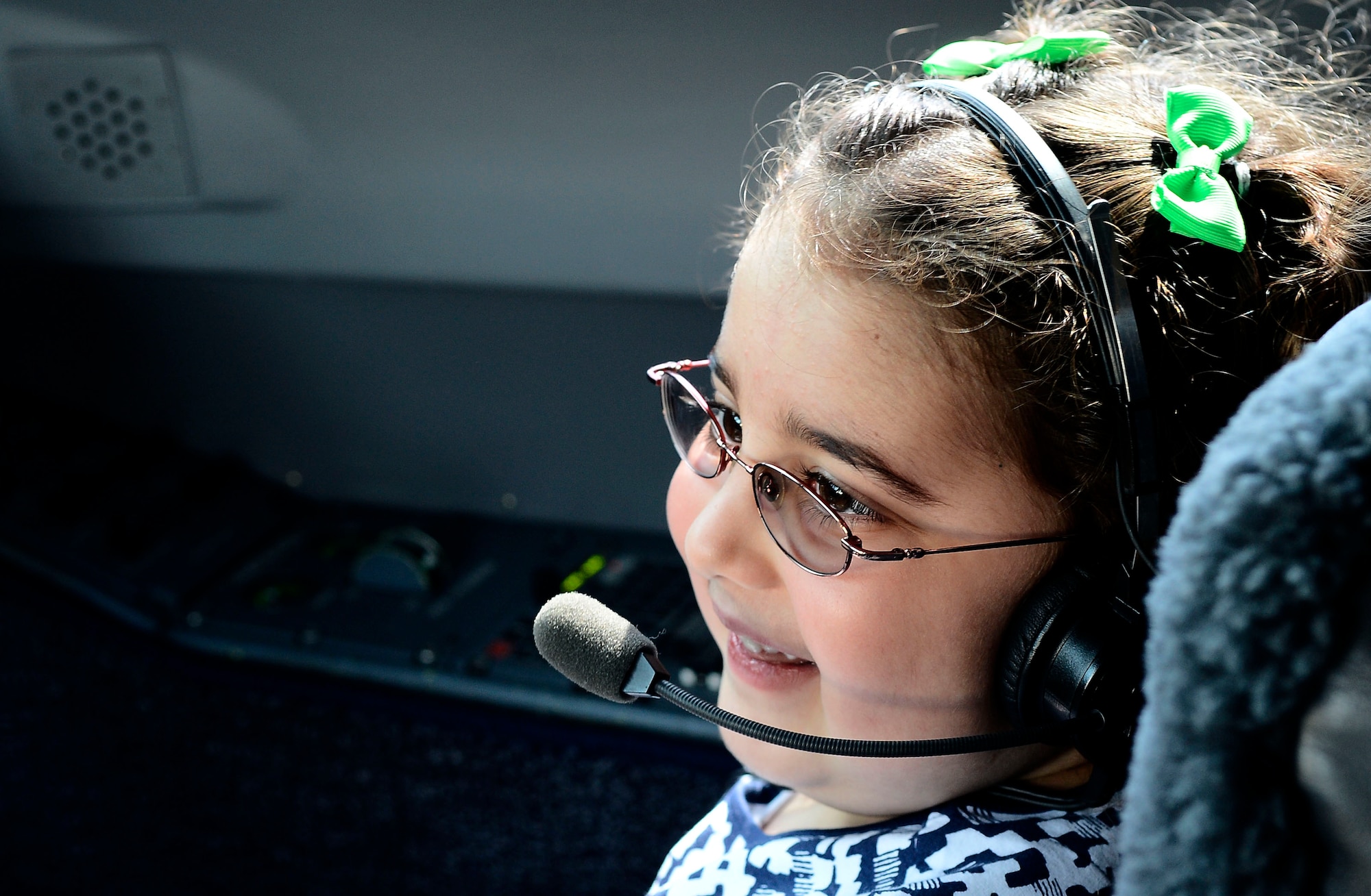 Molly Little, age five, daughter of Tech. Sgt. Peter Little, 6th Logistics Readiness Squadron NCO in-charge of air freight, sits in the cockpit of a G-5 Gulfstream at MacDill Air Force Base, Fla. Aug. 1, 2014. Molly was diagnosed with Diffuse Intrinsic Pontine Glioma, an inoperable, terminal tumor on her brain stem. In a collaborative effort to show support to a fellow Airman and give a well-deserving child a special day, numerous units from around MacDill joined together to make her dreams a reality. (U.S. Air Force photo by Airman 1st Class Tori Schultz/Released)