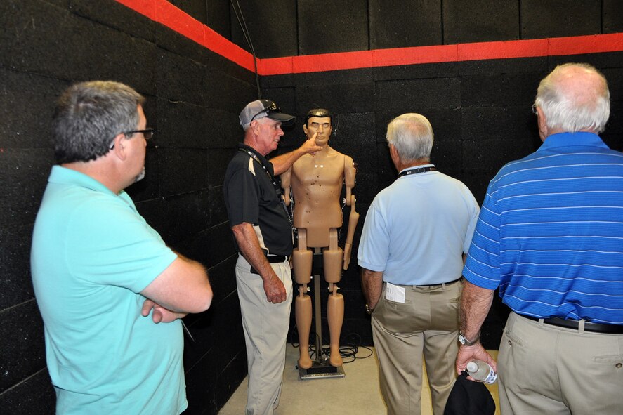 CAMP RAVENNA, Ohio – An attendee of the 2nd Annual Joint Employer Awareness Event points out a “head shot” on a training mannequin in a state-of-the-art urban combat simulation shoot house here, Aug. 8, 2014. The two-day event, designed to give civilian employers of Air Force Reservists and Ohio National Guardsmen a better understanding of the mission their employees carry out as members of the U.S. Armed Forces, also gave attendees the opportunity to get an up-close look at both the 910th's facilities at nearby Youngstown Air Reserve Station, Ohio and the Ohio National Guard's Joint Military Training Center here. U.S. Air Force photo by Master Sgt. Bob Barko Jr.