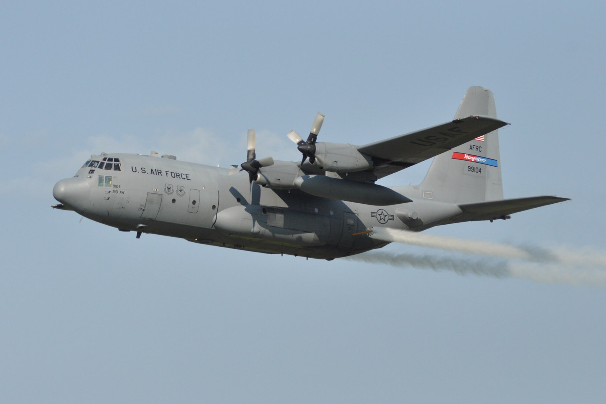 YOUNGSTOWN AIR RESERVE STATION, Ohio – An Air Force Reserve aircrew aboard specially-modified C-130 Hercules tactical cargo aircraft, assigned to the 910th Airlift Wing, perform aerial spray flight training during the 2nd Annual Joint Employer Awareness Event above the tactical assault strip on the airfield here, Aug. 7, 2014. The two-day event, designed to give civilian employers of Air Force Reservists and Ohio National Guardsmen a better understanding of the mission their employees carry out as members of the U.S. Armed Forces, also gave attendees the opportunity to get an up-close look at both the 910th's facilities and the Ohio National Guard's Joint Military Training Center, located at nearby Camp Ravenna, Ohio. The 910th Airlift Wing is home to the Department of Defense’s only large-area, fixed-wing aerial spray mission capability. U.S. Air Force photo by Master Sgt. Bob Barko Jr.