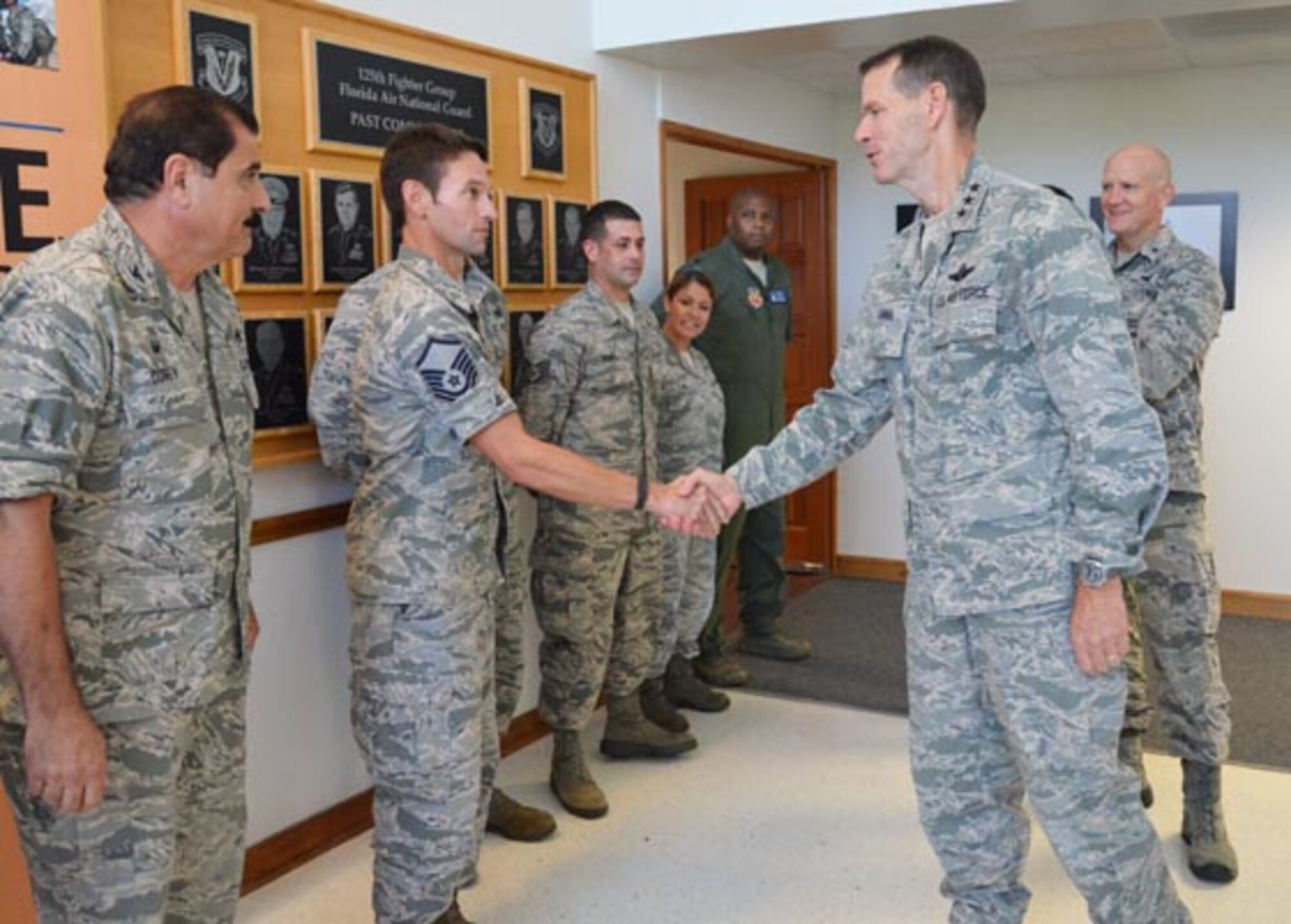 Director of the Air National Guard Lt. Gen. Stanley Clarke (right) meets with Airmen at the 125th Fighter Wing in Jacksonville during a tour of the Florida Air National Guard facilities, Aug. 20, 2014. Photo by Master Sgt. Thomas Kielbasa
