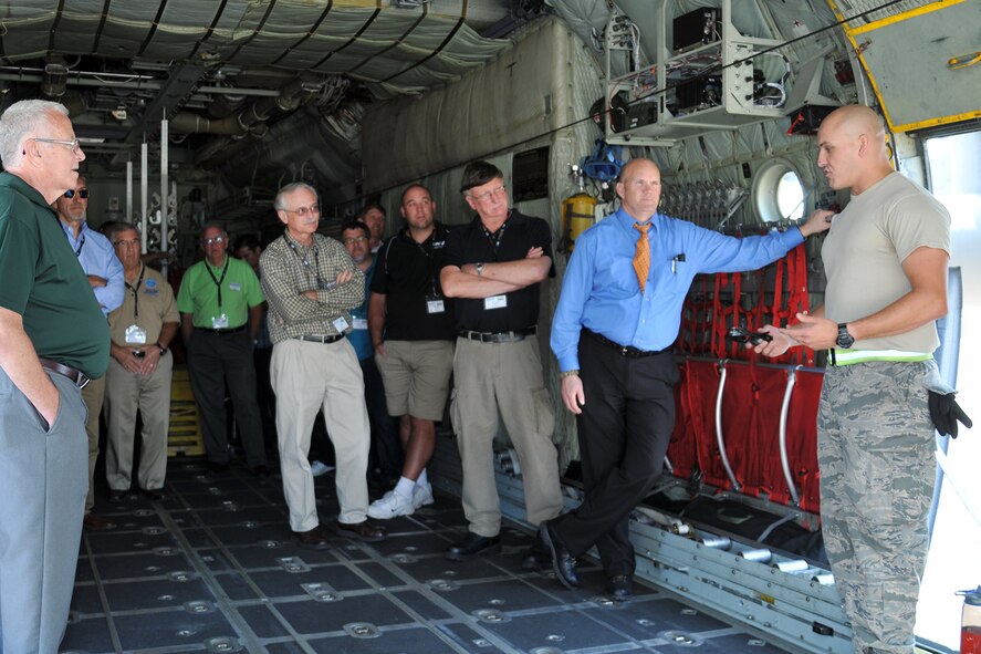 YOUNGSTOWN AIR RESERVE STATION, Ohio – Air Force Reserve Staff Sgt. Ethan Slark, an aerospace maintenance specialist assigned to the 910th Aircraft Maintenance Squadron, talks with a group of attendees during the 2nd Annual Joint Employer Awareness Event on the cargo deck of a C-130 Hercules tactical cargo aircraft on the flightline here, Aug. 7, 2014. The two-day event, designed to give civilian employers of Air Force Reservists and Ohio National Guardsmen a better understanding of the mission their employees carry out as members of the U.S. Armed Forces, also gave attendees the opportunity to get an up-close look at both the 910th's facilities and the Ohio National Guard's Joint Military Training Center, located at nearby Camp Ravenna, Ohio. U.S. Air Force photo by Tech. Sgt. James Brock