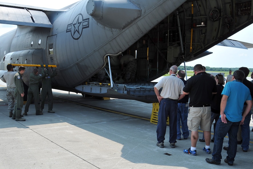 YOUNGSTOWN AIR RESERVE STATION, Ohio – A group of attendees of the 2nd Annual Joint Employer Awareness Event watch as aircrew members and Aerial Spray Maintenance personnel mount a spray nozzle boom into the crew door of a specially-modified C-130 Hercules aircraft on the flightline here, Aug. 7, 2014. The two-day event, designed to give civilian employers of Air Force Reservists and Ohio National Guardsmen a better understanding of the mission their employees carry out as members of the U.S. Armed Forces, also gave attendees the opportunity to get an up-close look at both the 910th's facilities and the Ohio National Guard's Joint Military Training Center, located at nearby Camp Ravenna, Ohio. The 910th Airlift Wing is home to the Department of Defense’s only large-area, fixed-wing aerial spray mission capability. U.S. Air Force photo by Tech. Sgt. James Brock