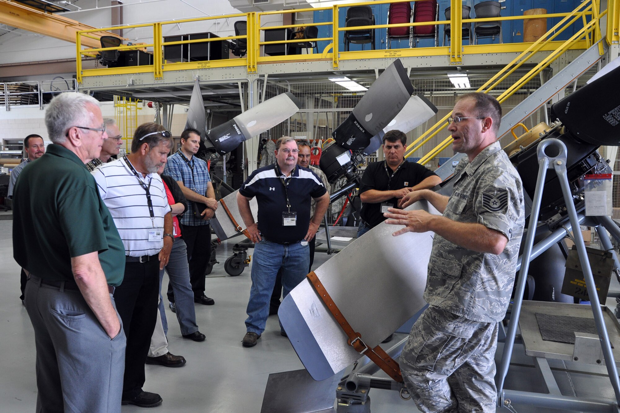 YOUNGSTOWN AIR RESERVE STATION, Ohio – Air Force Reserve Tech. Sgt. Michael Woodall, an aerospace propulsion craftsman assigned to the 910th Maintenance Squadron, talks with a group of attendees during the 2nd Annual Joint Employer Awareness Event at the propulsion shop here, Aug. 7, 2014. The two-day event, designed to give civilian employers of Air Force Reservists and Ohio National Guardsmen a better understanding of the mission their employees carry out as members of the U.S. Armed Forces, also gave attendees the opportunity to get an up-close look at both the 910th's facilities and the Ohio National Guard's Joint Military Training Center, located at nearby Camp Ravenna, Ohio. U.S. Air Force photo by Master Sgt. Bob Barko Jr.