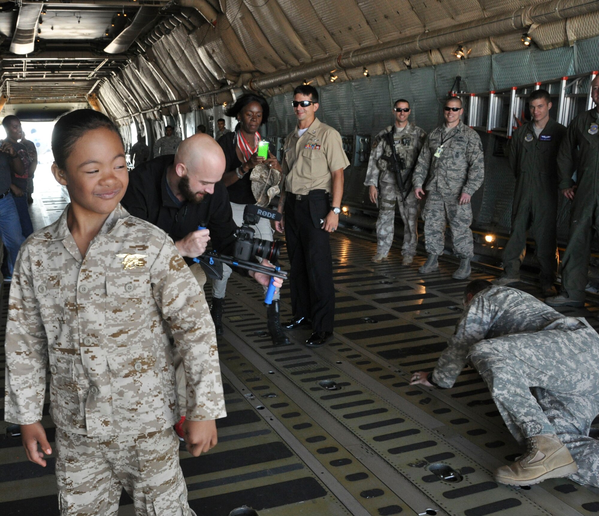 D’Marrion Otten glares at his fallen opponent Aug. 15 at Travis Air Force Base. D’Marrion’s wish of being a superhero for a day was granted by the Make-a-Wish Foundation. (U.S. Air Force photo by Airman 1st Class Amber Carter)