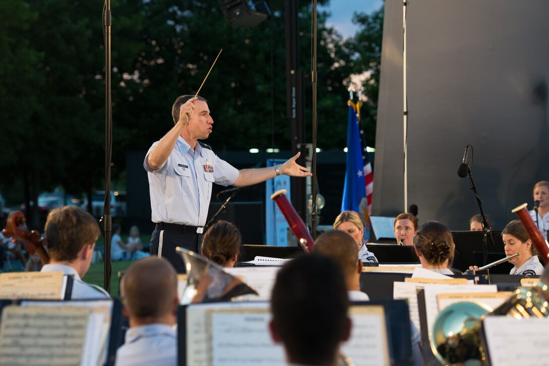 Major Michael Willen conducts the USAF Band during a summer concert at the Air Force memorial, Aug 15. (Courtesy photo by retired Chief Master Sgt. Jan Duga)