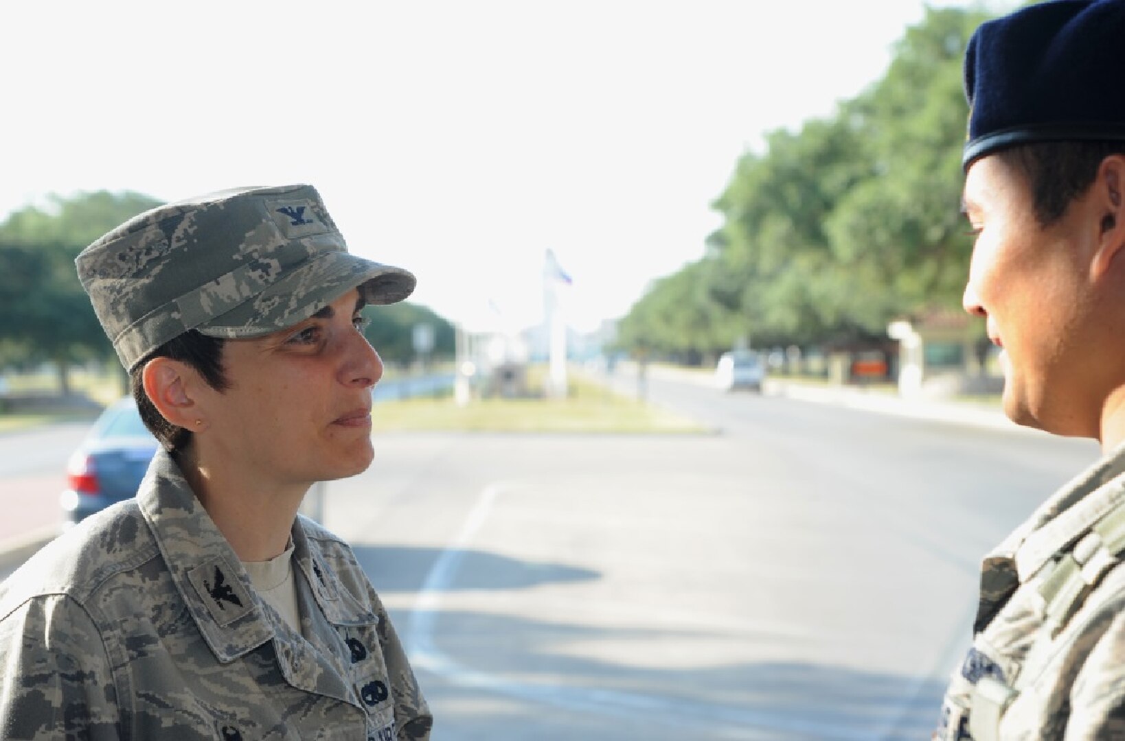 Col. Christine Erlewine (left), 502nd Security Forces and Logistics Support Group commander, speaks with Senior Airman Shasa Honse, 902nd Security Forces Squadron entry controller, Aug. 12 at the Joint Base San Antonio-Randolph Main Gate. (U.S. Air Force photo by Airman 1st Class Stormy Archer)
