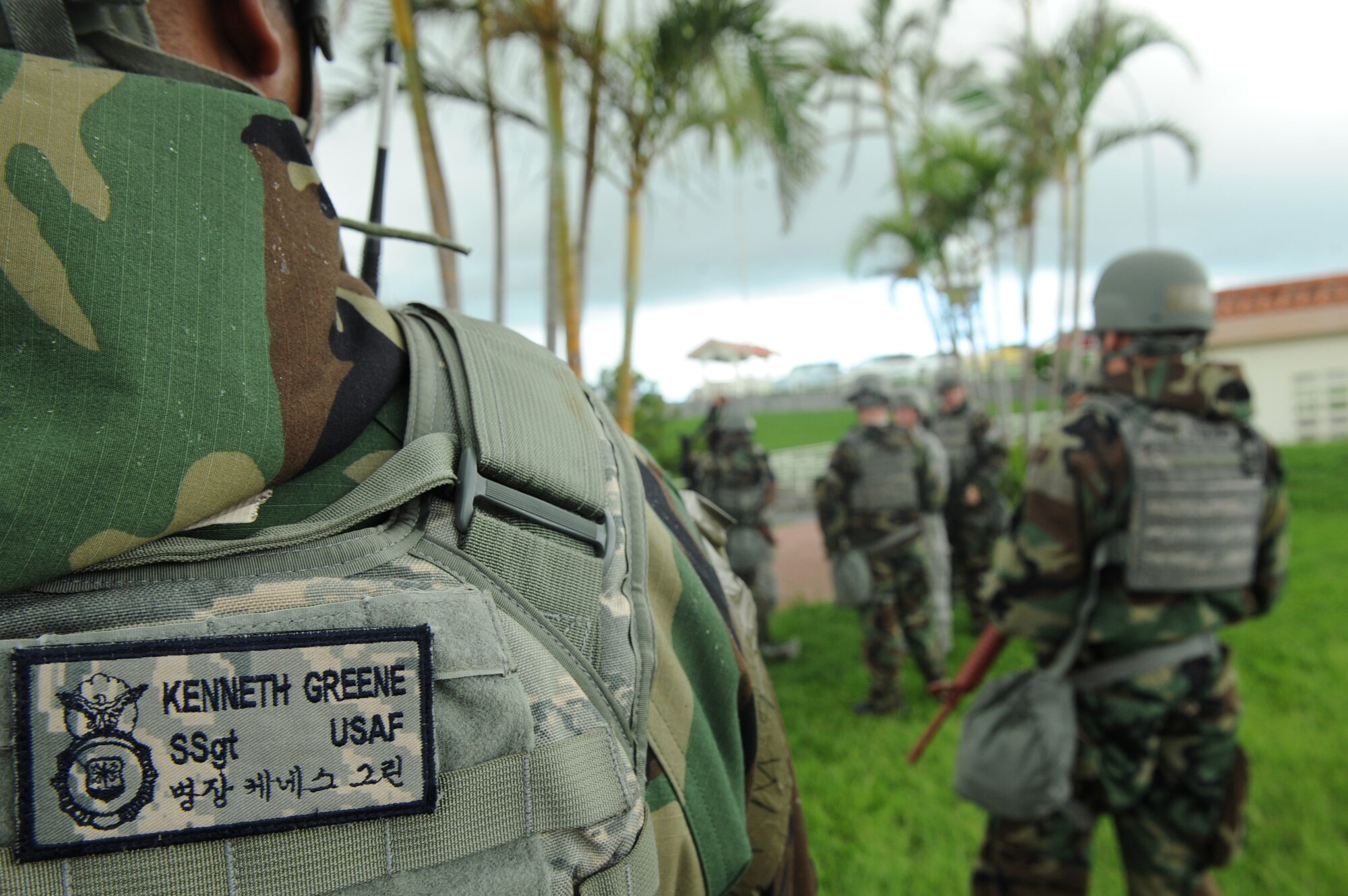 U.S. Air Force Staff Sgt. Kenneth Green, 18th Security Forces Squadron desk sergeant and Wing Inspection Team member, evaluates 18th SFS Airmen during the wing's mission focused exercise on Kadena Air Base, Japan, Aug. 21, 2014. WIT members are required to be trained, certified and sworn-in by oath before executing their duties as augmentees for the base Inspector General team, acting under the authority of the wing commander through direction from the wing IG to help ensure the wing is prepared to execute its wartime mission.   (U.S. Air Force photo by Airmen 1st Class Stephen G. Eigel)

