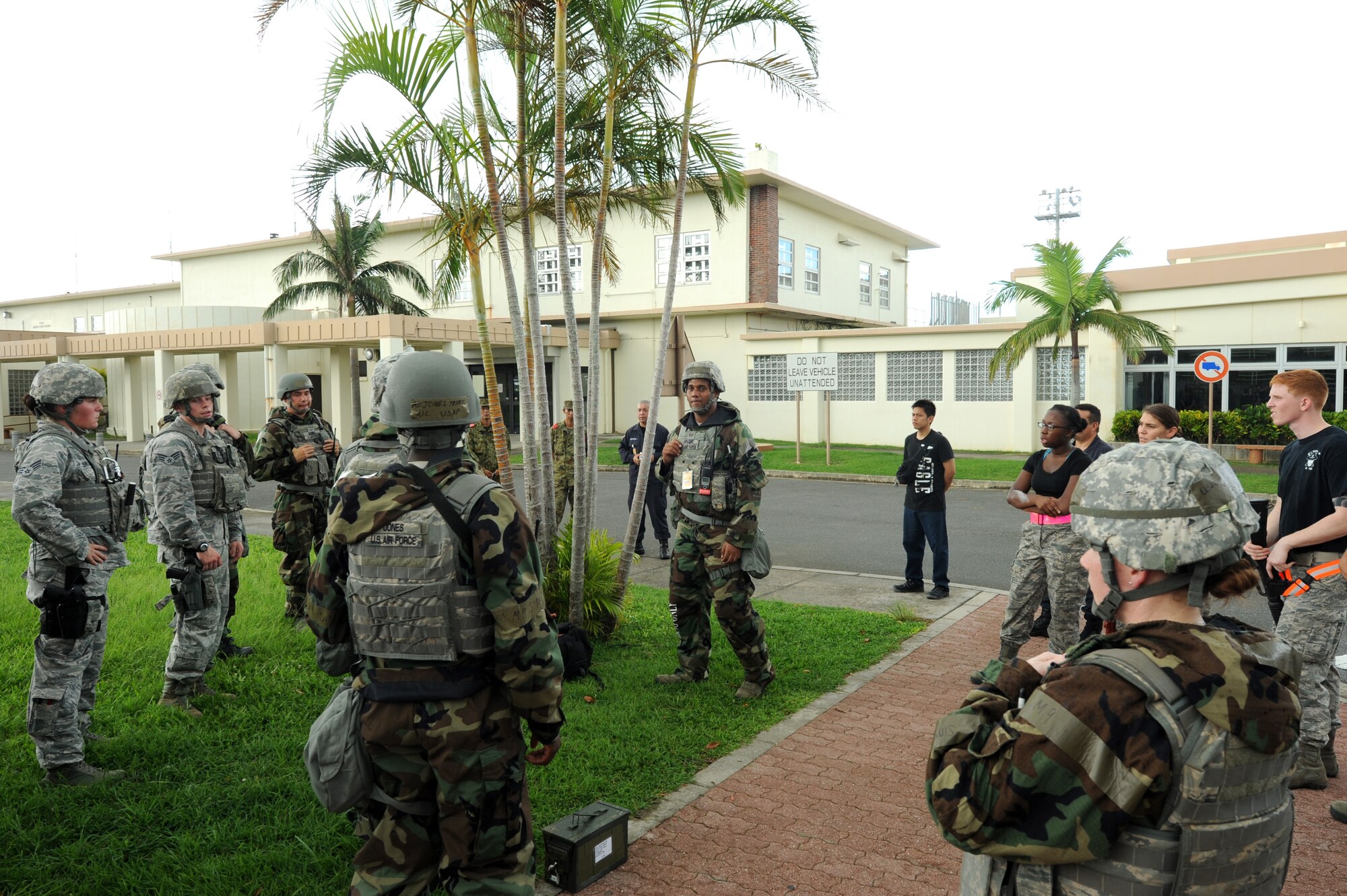 U.S. Air Force Staff Sgt. Kenneth Green, 18th Security Forces Squadron desk sergeant and Wing Inspection Team member, debriefs Airmen after a mission focused exercise inject where opposing forces broke onto base and tried to take over on Kadena Air Base, Japan, Aug. 21, 2014. Responsible for providing an accurate and unbiased report on their unit performance, WIT members are subject matter experts across the wing in their respective career fields. (U.S. Air Force photo by Airmen 1st Class Stephen G. Eigel)