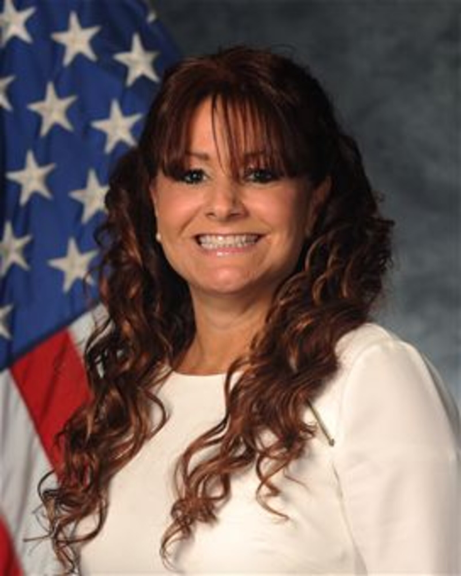 Jennifer Remoy, Bitburg Middle High School principal, poses for an official photo at Spangdahlem Air Base, Germany, August 11, 2014. Remoy previously served at Ramstein Intermediate School in Germany as principal before coming to Bitburg Middle High School. (U.S. Air Force photo by Staff Sgt. Joe McFadden/Released)