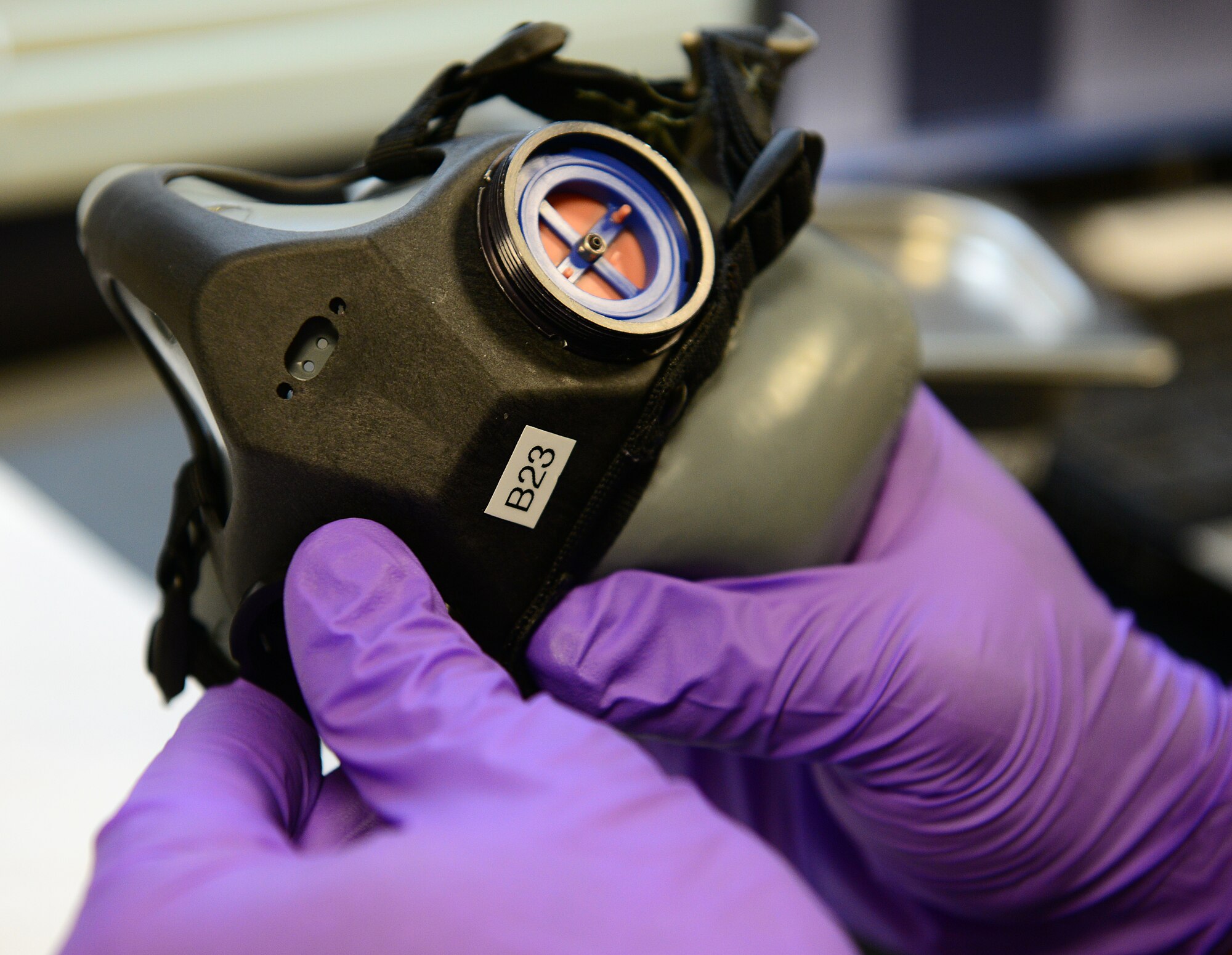 Airman 1st Class Jonathan Greene, 31st Operations Support Squadron aircrew flight equipment technician, rebuilds a pilot’s MBU 20-P mask, Aug. 19, 2014, at Aviano Air Base, Italy. AFE Airmen are responsible for all the pilots’ equipment they carry as well as the equipment that is installed inside the aircraft. (U.S. Air Force photo/Senior Airman Matthew Lotz)