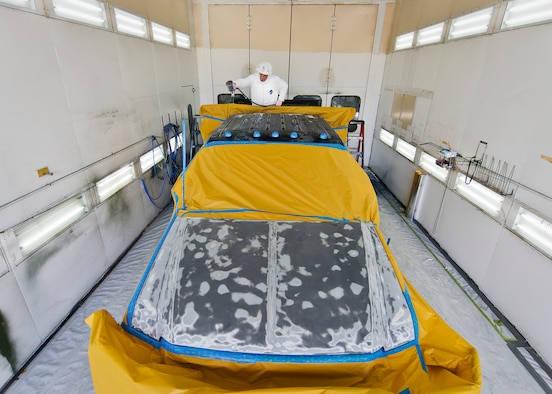 Henry Isaacs, 96th Logistics Readiness Squadron, prepares to paint the roof of a truck Aug. 20 at Eglin Air Force Base, Fla.  Repainting vehicle parts highly affected by the sun and weather is part of 96th LRS’s corrosion control program.  A three-person team is responsible for restoring and extending the lives of Eglin’s vehicle fleet.  Approximately 50 vehicles per year are painted by the team. (U.S. Air Force photo/Samuel King Jr.)