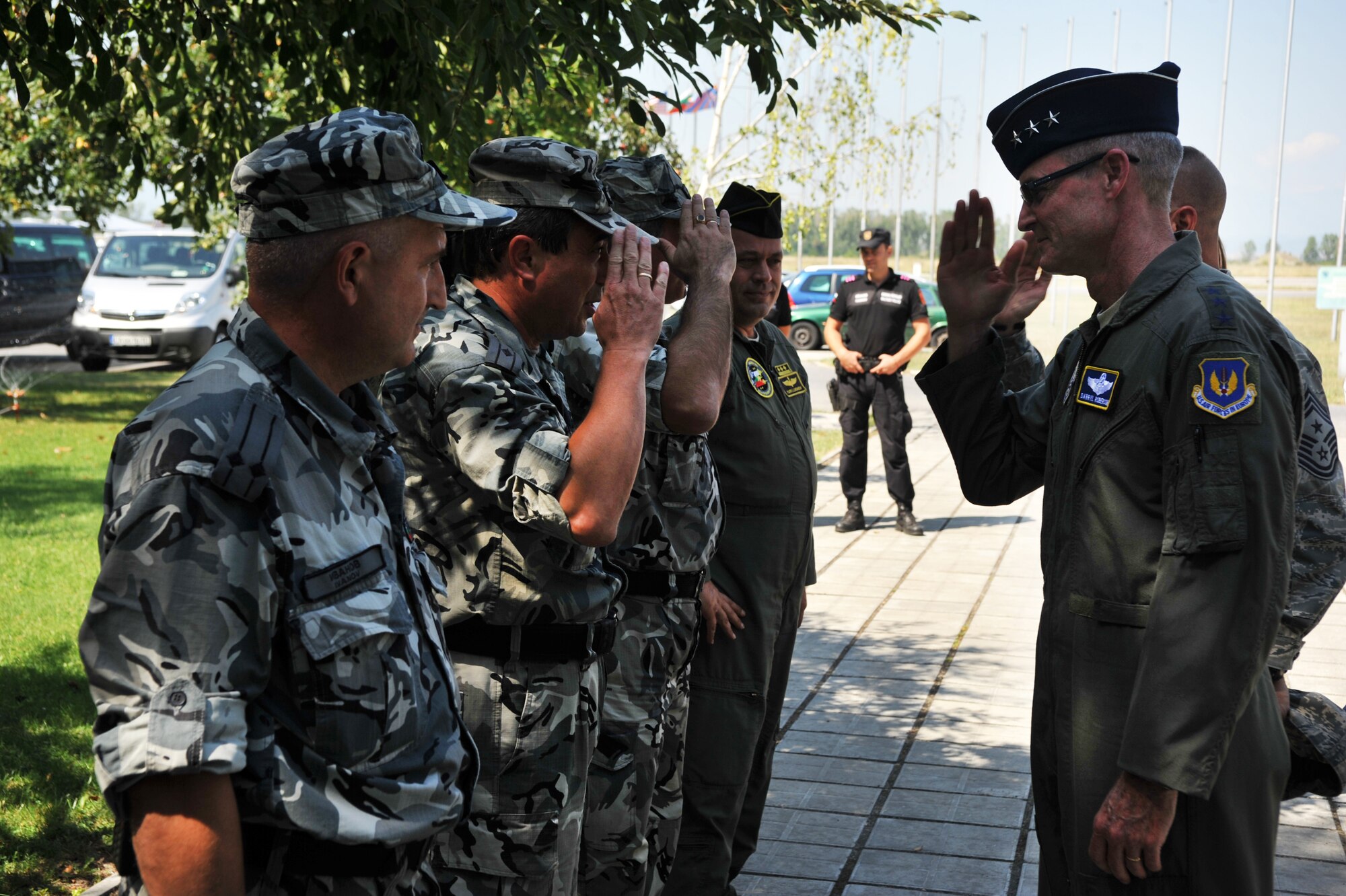 Lt. Gen. Darryl Roberson, 3rd Air Force commander, is greeted by Bulgarian Air Force members upon his visit to Graf Ignatievo Air Base Aug. 20, 2014. As part of the visit, Roberson received a brief from Bulgarian Brig. Gen. Ivan Lalov, Graf Ignatievo Air Base commander, about the history of the base and how his Air Force plans to enhance interoperability with the U.S. (U.S. Air Force photo/Senior Airman Hailey Haux)