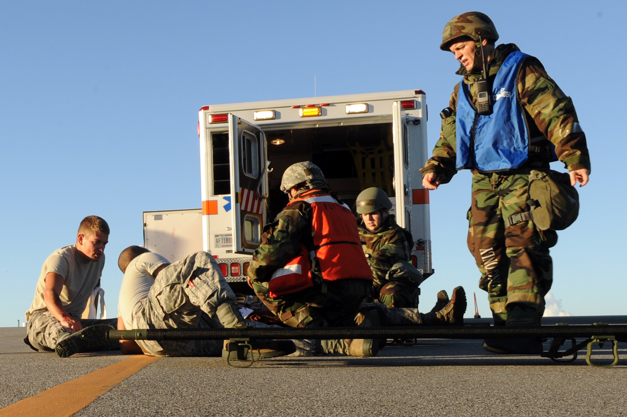 U.S. Air Force Senior Airman Christopher Gaines, 18th Aerospace Medicine Squadron flight operational medical technician and field response team member, prepares to lift a simulated patient onto a litter on Kadena Air Base, Japan, Aug. 21, 2014. FRT members augment the 18th Medical Group’s ambulance services team due to limited resources, sometimes acting as first responders. (U.S. Air Force photo by Airman 1st Class Zade C. Vadnais/Released)