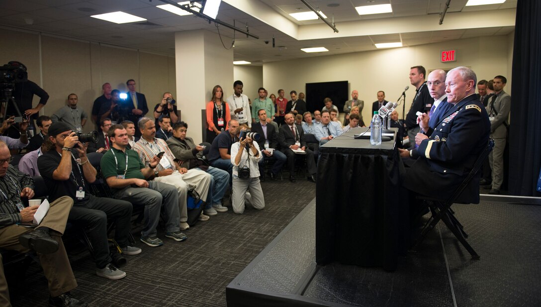 Army Gen. Martin E. Dempsey, chairman of the Joint Chiefs of Staff, addresses reporters and photographers during a joint press conference with National Basketball Association Commissioner Adam Silver at Madison Square Garden in New York, Aug. 20, 2014. 