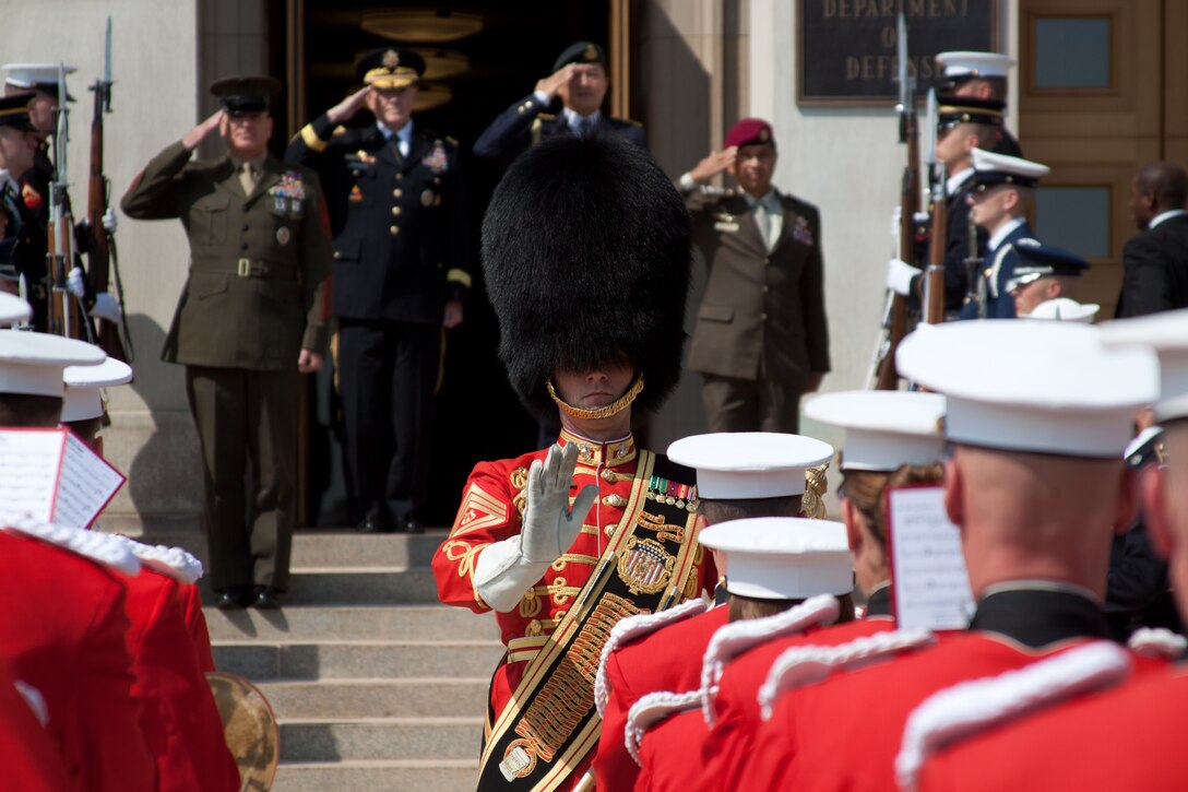 Marine Band Drum Major Gunnery Sgt. Duane F. King leads the Marine Band in an arrival ceremony for Singapore Armed Forces Defense Chief Lieutenant-General Ng Chee Meng. (U.S. Marine Corps photo by Staff Sgt. Brian Rust/released)