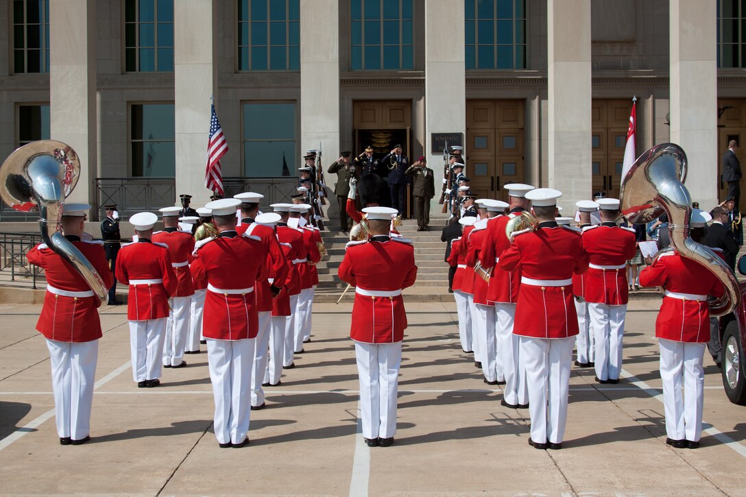 Marine Band Drum Major Gunnery Sgt. Duane F. King leads the Marine Band in an arrival ceremony for Singapore Armed Forces Defense Chief Lieutenant-General Ng Chee Meng. (U.S. Marine Corps photo by Staff Sgt. Brian Rust/released)