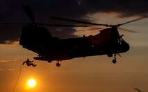 A U.S. Marine assigned to Echo Company 4th Reconnaissance Battalion rappells out of a CH-46E Sea Knight helicopter at Camp Upshur, Marine Corps Base (MCB) Quantico Va., July 17, 2014.  The training exercise was part of a week-long jump, dive, breach, and shooting package conducted around MCB Quantico. (U.S. Marine Corps photo by Staff Sgt. Ezekiel R. Kitandwe/Released)
