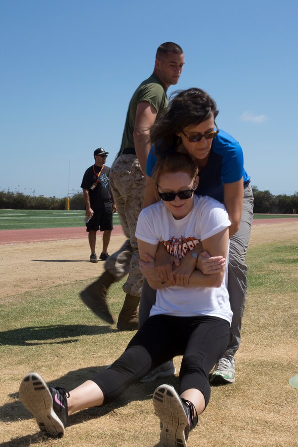 MARINE CORPS RECRUIT DEPOT SAN DIEGO - Educators and community influencers with Recruiting Stations Seattle and San Diego participate in a modified combat fitness test, Aug. 12, 2014. The educators and community leaders have the chance to learn about the transition from civilian to Marine and what is expected of a Marine on a day-to-day basis to better understand what the Marine Corps can offer for a transitioning young man or woman. (Official U.S. Marine Corps Photo by Sgt. Rebecca Eller)
