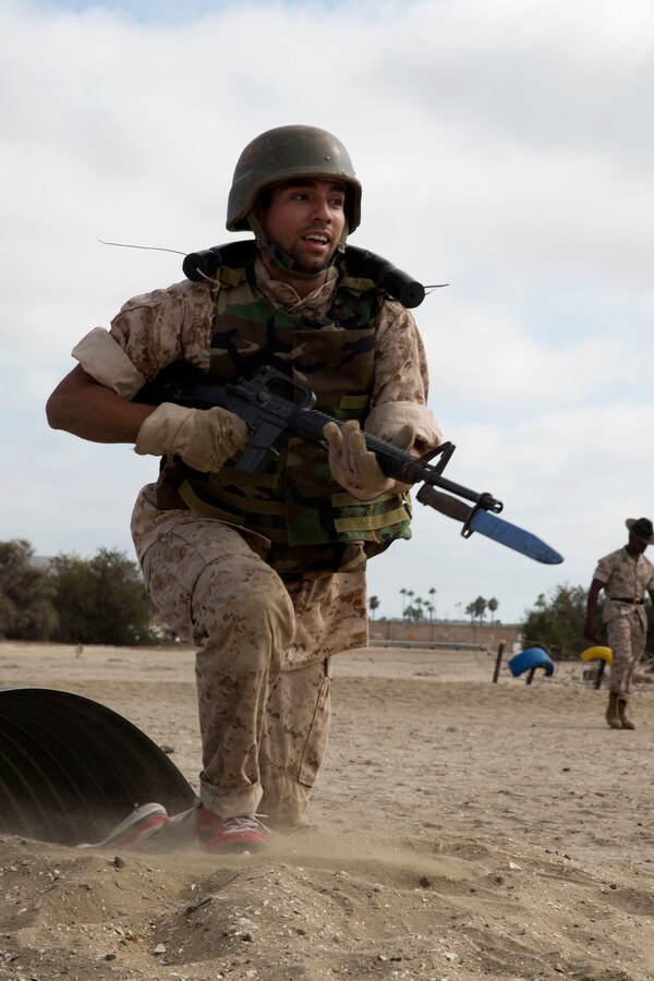 MARINE CORPS RECRUIT DEPOT SAN DIEGO - Educators and community influencers with Recruiting Stations Seattle and San Diego run through the bayonet course, Aug. 12, 2014. The educators and community leaders have the chance to learn about the transition from civilian to Marine and what is expected of a Marine on a day-to-day basis to better understand what the Marine Corps can offer for a transitioning young man or woman. (Official U.S. Marine Corps Photo by Sgt. Rebecca Eller)