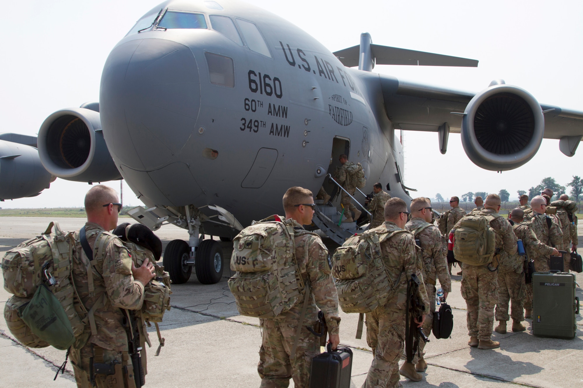 Oregon Army National Guard, 41st Infantry Brigade Combat Team Soldiers from load onto a C-17 Globemaster III Aug. 13, 2013, bound for Afghanistan from Mihail Kogalniceanu Air Base, Romania. The flight is one of more than 500, deploying and redeploying transportation missions, that the U.S. Army Europe's 21st Theater Sustainment Command and Air Force's 780th Expeditionary Airlift Squadron have supported since opening the transit hub in February 2014. (U.S. Army photo/Sgt. Brandon Hubbard)