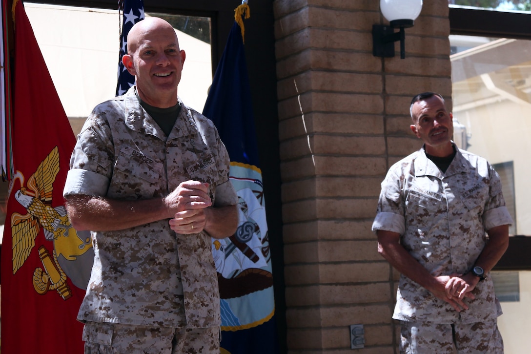 Lieutenant Gen. David H. Berger (left), commanding general, I Marine Expeditionary Force, speaks before promoting Brig. Gen. Vincent A. Coglianese (right), commanding general, 1st Marine Logistics Group, to major general aboard Camp Pendleton, Calif., Aug. 19, 2014. Berger said Coglianese's selection to a two-star general position was a direct reflection of his ability to successfully lead in three particularly difficult billets during his time as a brigadier general.