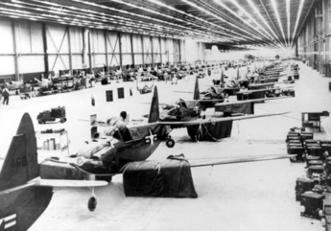 A PQ-14 line at Building 3001 at Tinker Air Force Base circa 1947. Building 3001 burned during a fire in November 1984. Two days after the fire the Air Force approached the Tulsa District about repairs and the Corps embarked on a massive project to replace the building. The new building was completed on time, within budget and with no loss of life.