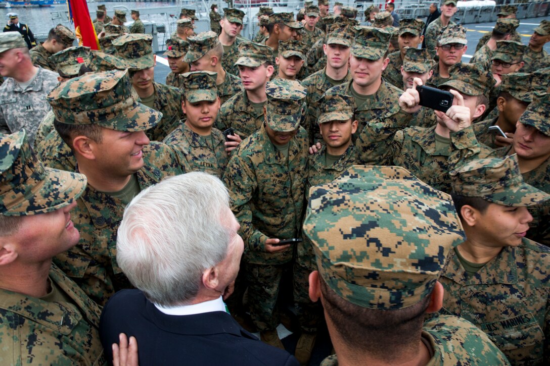 Marines crowd around Secretary of the Navy Ray Mabus for pictures during his visit to the Marines and sailors of Marine Forces South, 1st Battalion, 23rd Marines, 4th Civil Affairs Group, 4th Marine Logistics Group and Marine Medium Helicopter Squadron 364 aboard the Chilean ship LSDH Sargento Aldea, August 21, 2014 in Valparaiso, Chile during Partnership of the Americas 2014. POA 14 is designed to enhance joint and combined interoperability, increase the combined capability to execute Amphibious Operations, Peace Support Operations, and Humanitarian Assistance/Disaster Relief missions, and further develop strong and lasting relationships the U.S. Marine Corps has established with partner nation’s naval infantries/marine corps.
