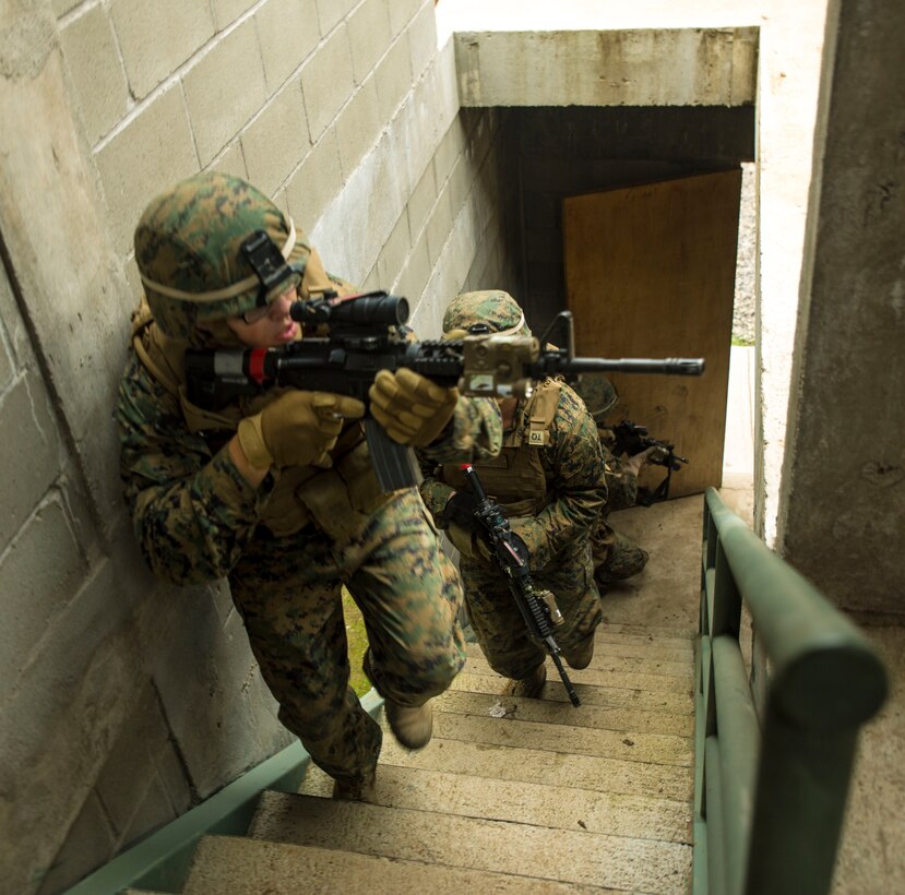Lance Cpl. Justin Mcallister, infantryman from 1st Division, 23rd Marines leads a squad of Marines through a building during a training evolution designed to simulate urban combat August 20, 2014, as part of Partnership of the Americas 2014. Representatives from Argentina, Brazil, Canada, Chile, Colombia, Mexico, Paraguay, and the United States are participating in POA 2014 from August 11-22, 2014. This exercise is designed to enhance joint and combined interoperability, increase the combined capability to execute Amphibious Operations, Peace Support Operations, and Humanitarian Assistance/Disaster Relief missions, and further develop strong and lasting relationships the U.S. Marine Corps has established with partner nation’s naval infantries/marine corps.