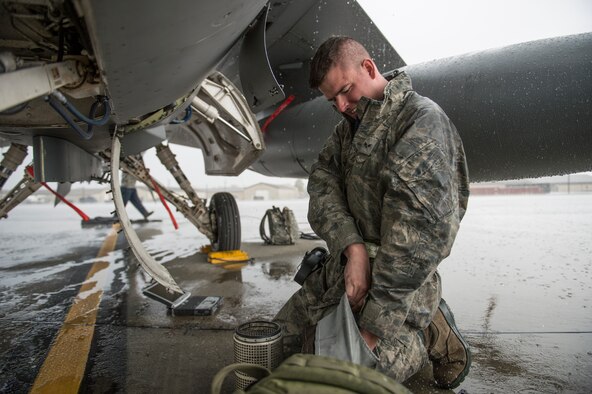 Senior Airman James Gunning changes a water sock filter on an F-16 Fighting Falcon during Red Flag-Alaska 14-3 Aug. 18, 2014, on Eielson Air Force Base, Alaska. Gunning supported the aircraft which flew two sorties a day throughout the exercise. He is a 8th Aircraft Maintenance Squadron electrical and environmental specialist assigned to Kunsan Air Base, South Korea. (U.S. Air Force photo/Senior Airman Peter Reft)