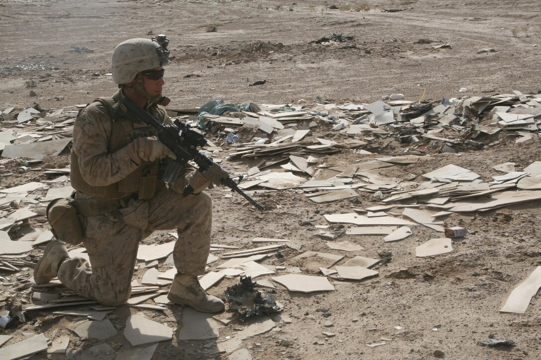 Marines with Weapons Company conduct security patrol in Helmand