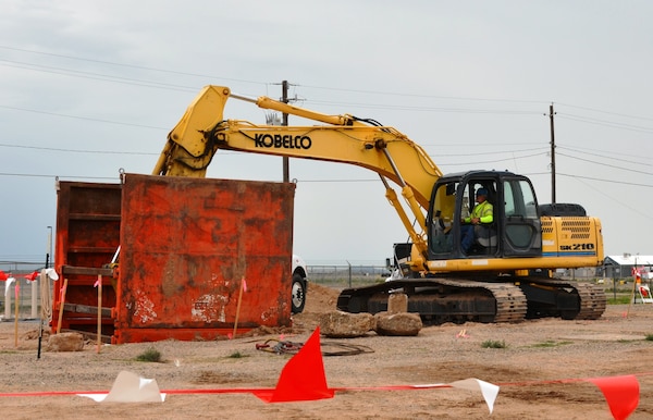 ALBUQUERQUE, N.M., -- Construction workers for CB&I excavate contaminated soils from the Former Fuels Off-Loading Rack area at Kirtland Air Force Base, Aug. 7, 2014.