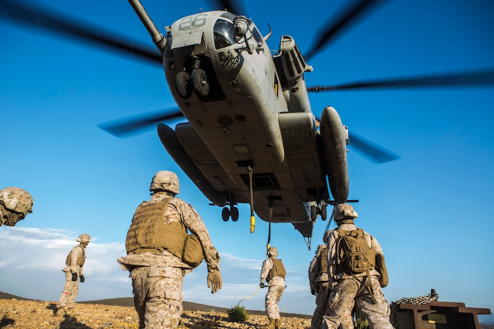 A CH-53E Super Stallion with Marine Heavy Helicopter Squadron (HMH) 462 maintains an extremely low altitude for a Helicopter Support Team with Combat Logistics Regiment 17 aboard Marine Corps Air Station Miramar, Calif., Aug. 21. HMH-462 transported simulated cargo while the HST conducted training that included connecting and disconnecting cargo.