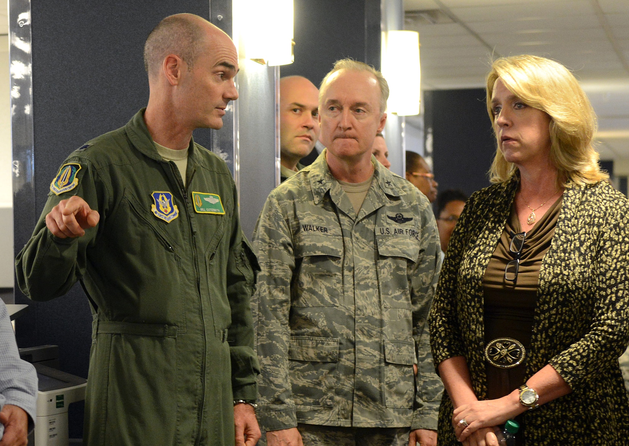 Lt. Col. Bill Gutermuth, left, briefs Secretary of the Air Force Deborah Lee James as Brig. Gen. Edmund D. Walker listens during her visit to the Force Generation Center Aug. 21, 2014, at Robins Air Force Base, Ga. The center ensures real-time visibility, accountability and long-range planning for reserve forces which provides reservists greater predictability in their deployment schedules. Gutermuth is with the Air Force Reserve Command and Walker is the commander of Force Generation Center, Headquarters AFRC. (U.S. Air Force photo/Tommie Horton)