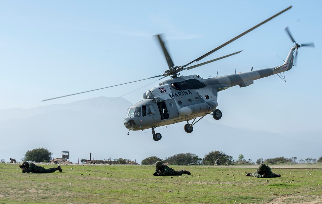 Service members participating in Partnership of the Americas 2014 practice on/off drills on a MI-17 HIP helicopter, flown by Mexican pilots. Representatives from Argentina, Brazil, Canada, Chile, Colombia, Mexico, Paraguay, and the United States are participating in POA 2014 from August 11-22, 2014. This exercise is designed to enhance joint and combined interoperability, increase the combined capability to execute Amphibious Operations, Peace Support Operations, and Humanitarian Assistance/Disaster Relief missions, and further develop strong and lasting relationships the U.S. Marine Corps has established with partner nation’s naval infantries/Marine Corps.


